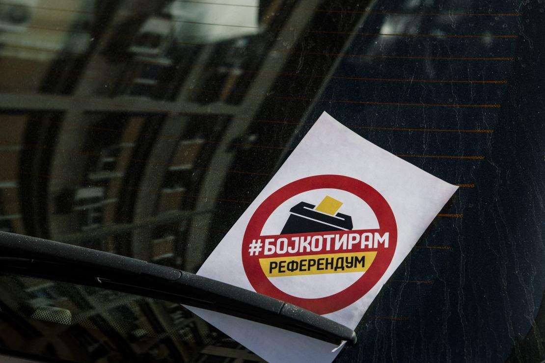 A flyer reading "I boycott" is seen on the windscreen of a car in Skopje.