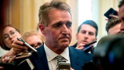 Sen. Jeff Flake, R-Ariz., listens to a question from a reporter after meeting with Senate Majority Leader Mitch McConnell of Ky. in his office in the Capitol in Washington, Friday, Sept. 28, 2018. The Senate Judiciary Committee advanced Brett Kavanaugh's nomination for the Supreme Court after agreeing to a late call from Sen. Jeff Flake, R-Ariz., for a one week investigation into sexual assault allegations against the high court nominee. (AP Photo/Andrew Harnik)