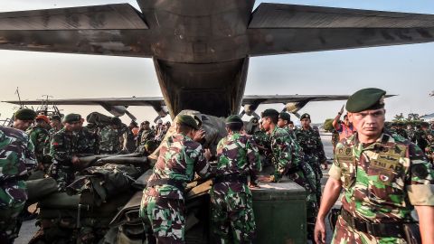 Indonesian soldiers load emergency supplies onto a military plane at a base in Jakarta, Indonesia's capital, before heading to Palu on September 29.