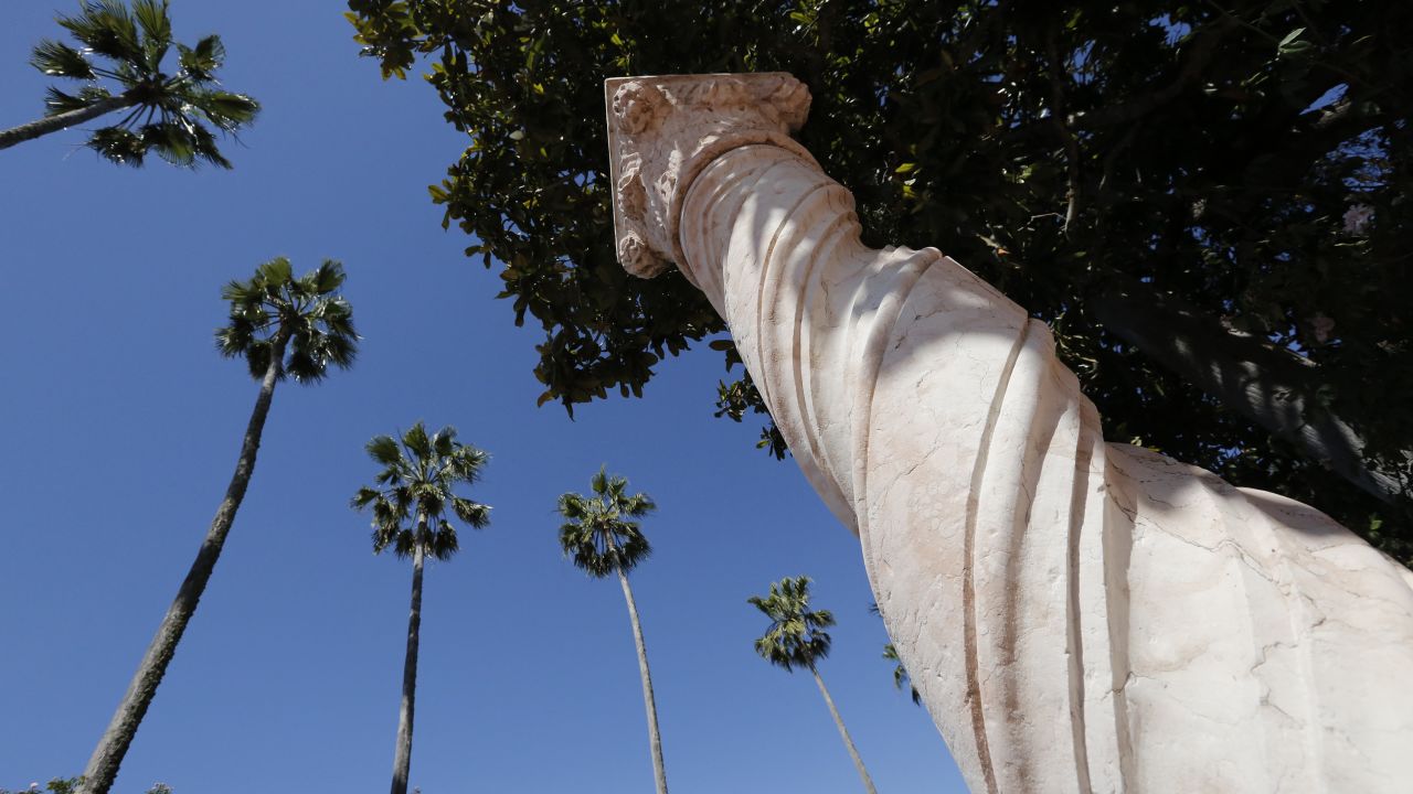 <strong>An ode to empire.</strong> Roman columns dot the expansive courtyards surrounding the main house and guesthouses. This marble column was purchased from an art dealer in 1920.