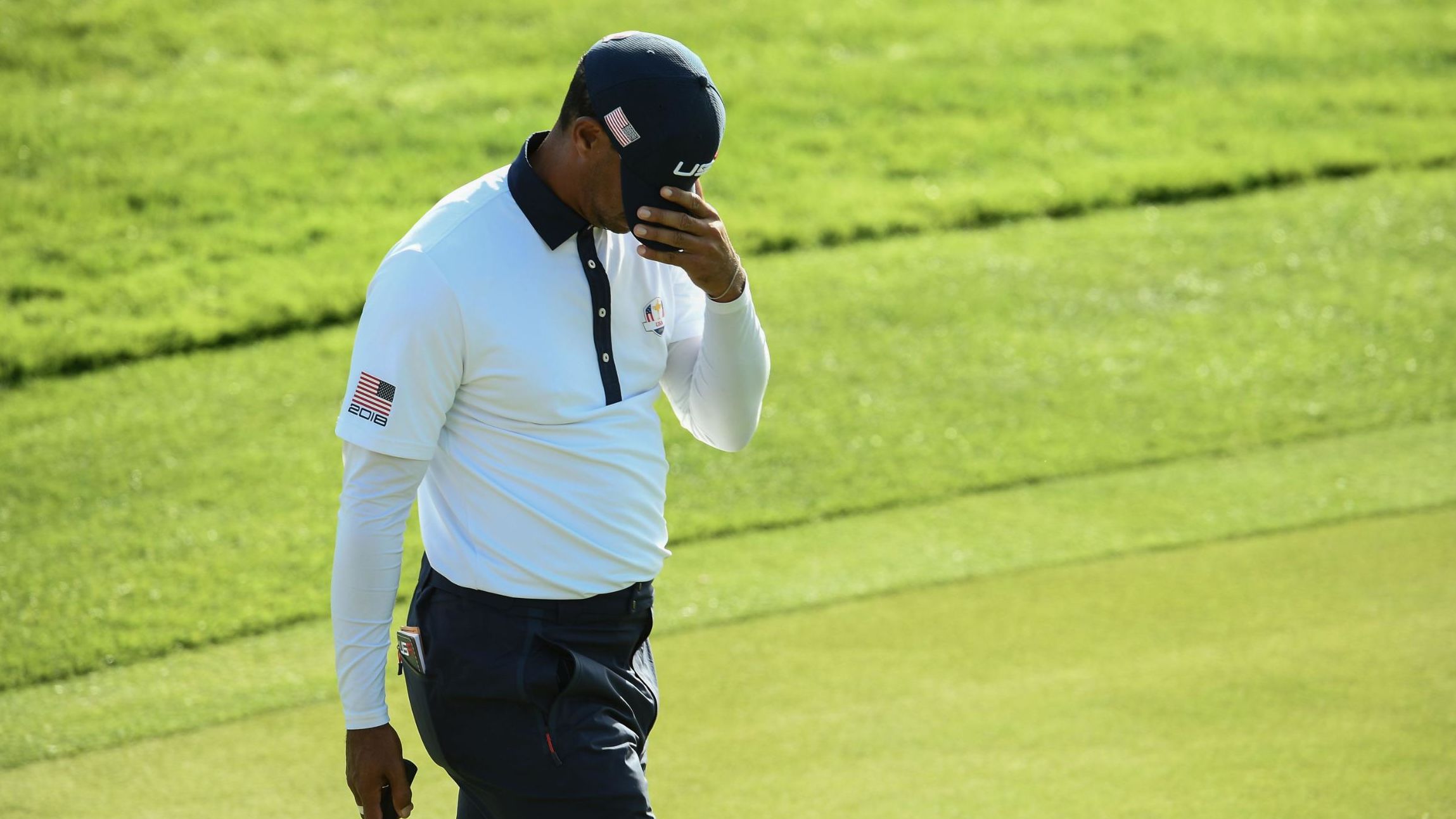 Tiger Woods reacts after losing his foursomes match on Day Two of the Ryder Cup on Saturday.