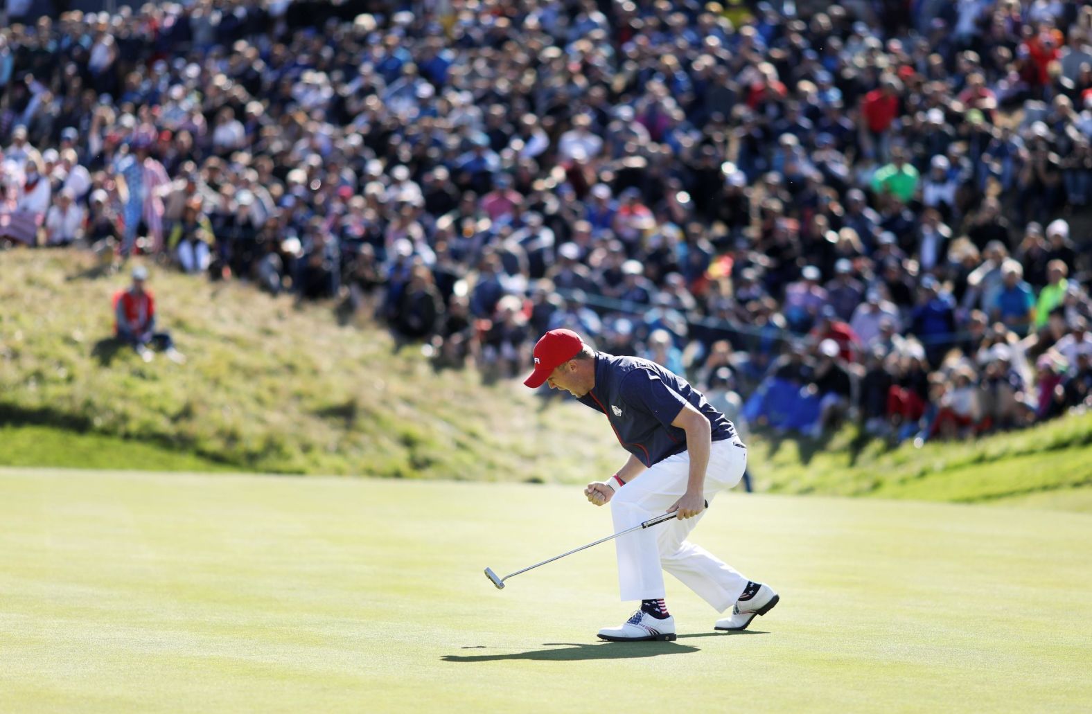 Justin Thomas of the US celebrates on the green during singles matches of the Ryder Cup at Le Golf National on Sunday, September 30, in Paris, France. 