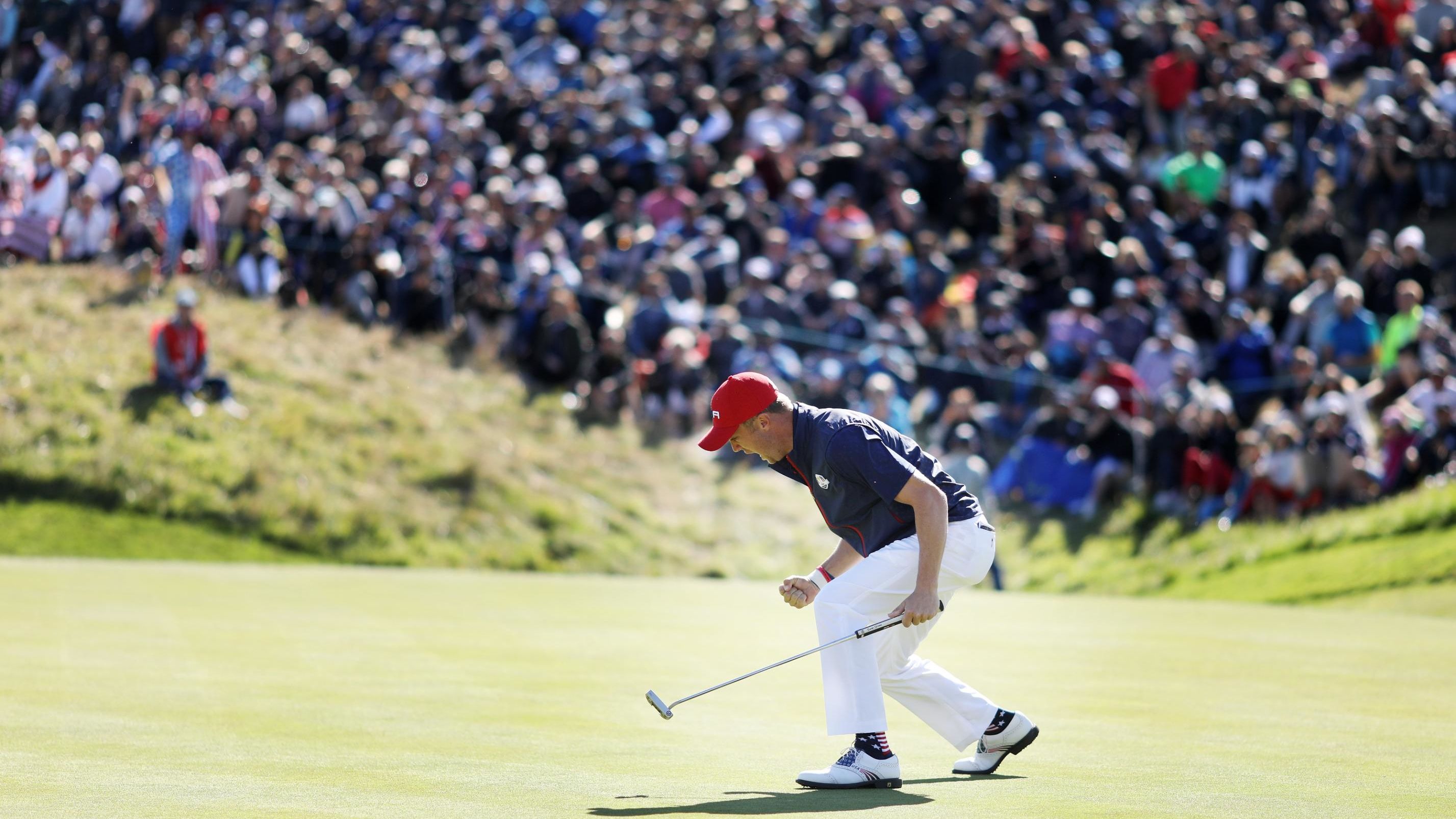 Justin Thomas of the US celebrates on the green during singles matches of the Ryder Cup at Le Golf National on Sunday, September 30, in Paris, France. 