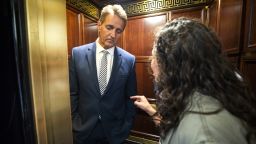 A woman who said she is a survivor of a sexual assault (R) confronts Republican Senator from Arizona Jeff Flake (L) in an elevator after Flake announced that he vote to confirm Supreme Court nominee Brett Kavanaugh in the Russell Senate Office Building in Washington, DC, on September 28. The woman, who used her foot to prevent the elevator door from closing,  said to Senator Flake 'Look at me when I'm talking to you. You are telling me that my assault doesn't matter.' 