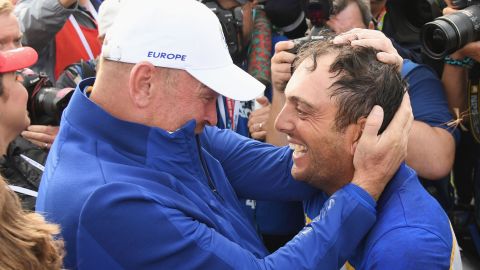 Francesco Molinari of Europe, right, celebrates winning the Ryder Cup with team captain Thomas Bjorn on Sunday.