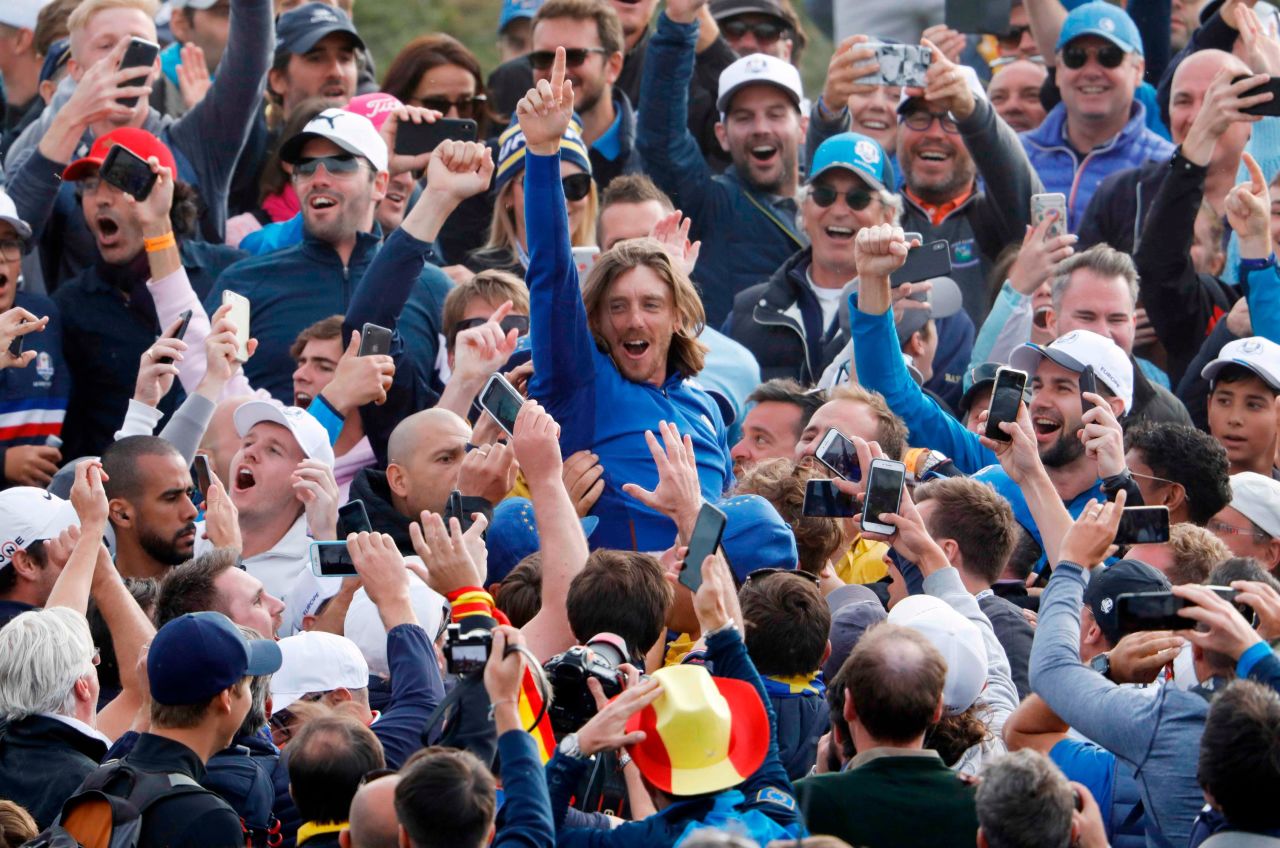 Team Europe's Tommy Fleetwood celebrates with spectators after winning the Ryder Cup on Sunday.