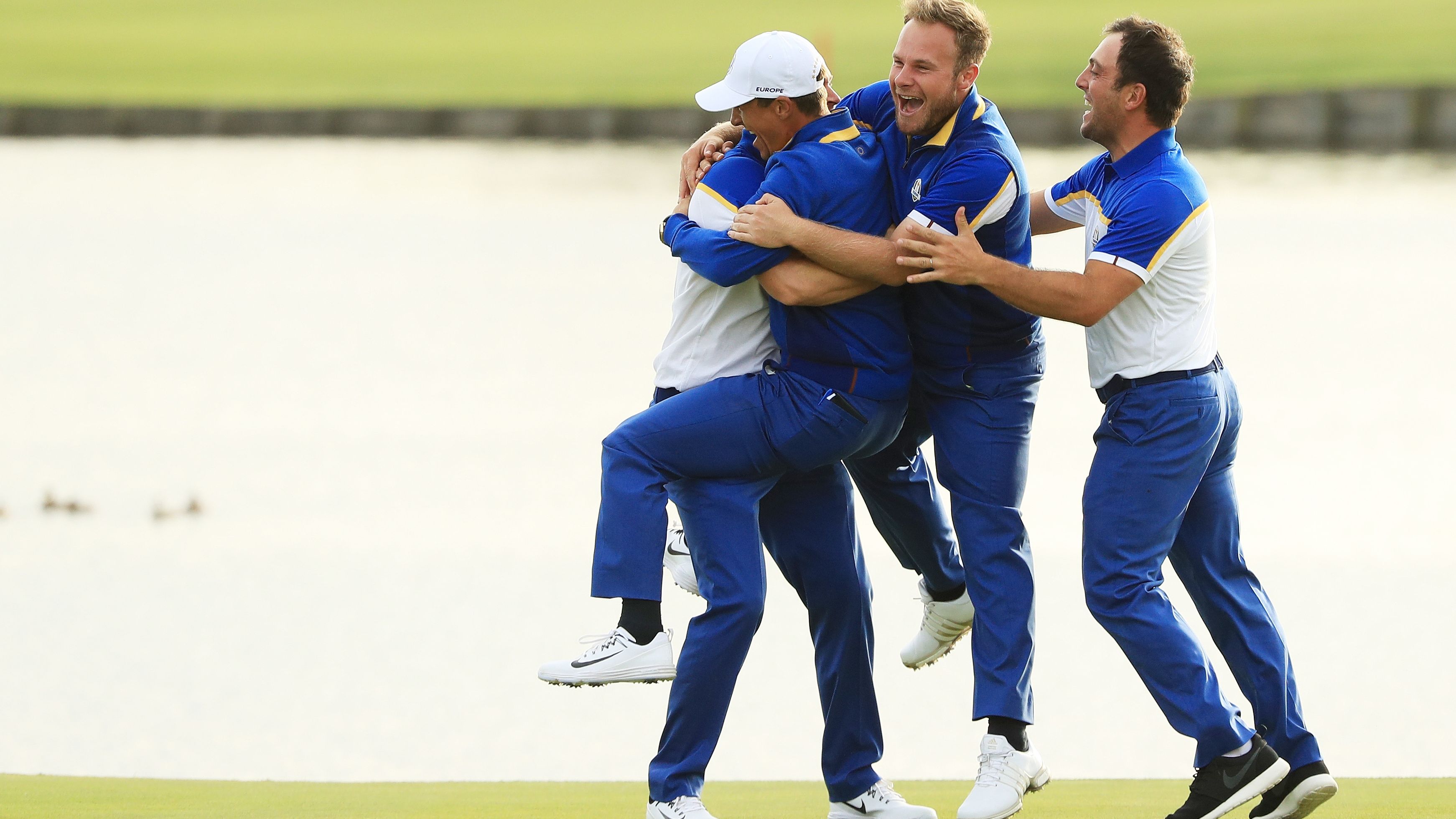Alex Noren of Europe celebrates with his teammates after winning his match on the 18th green. Europe won the Ryder Cup, defeating the US team on Sunday, September 30 in Paris, France. 