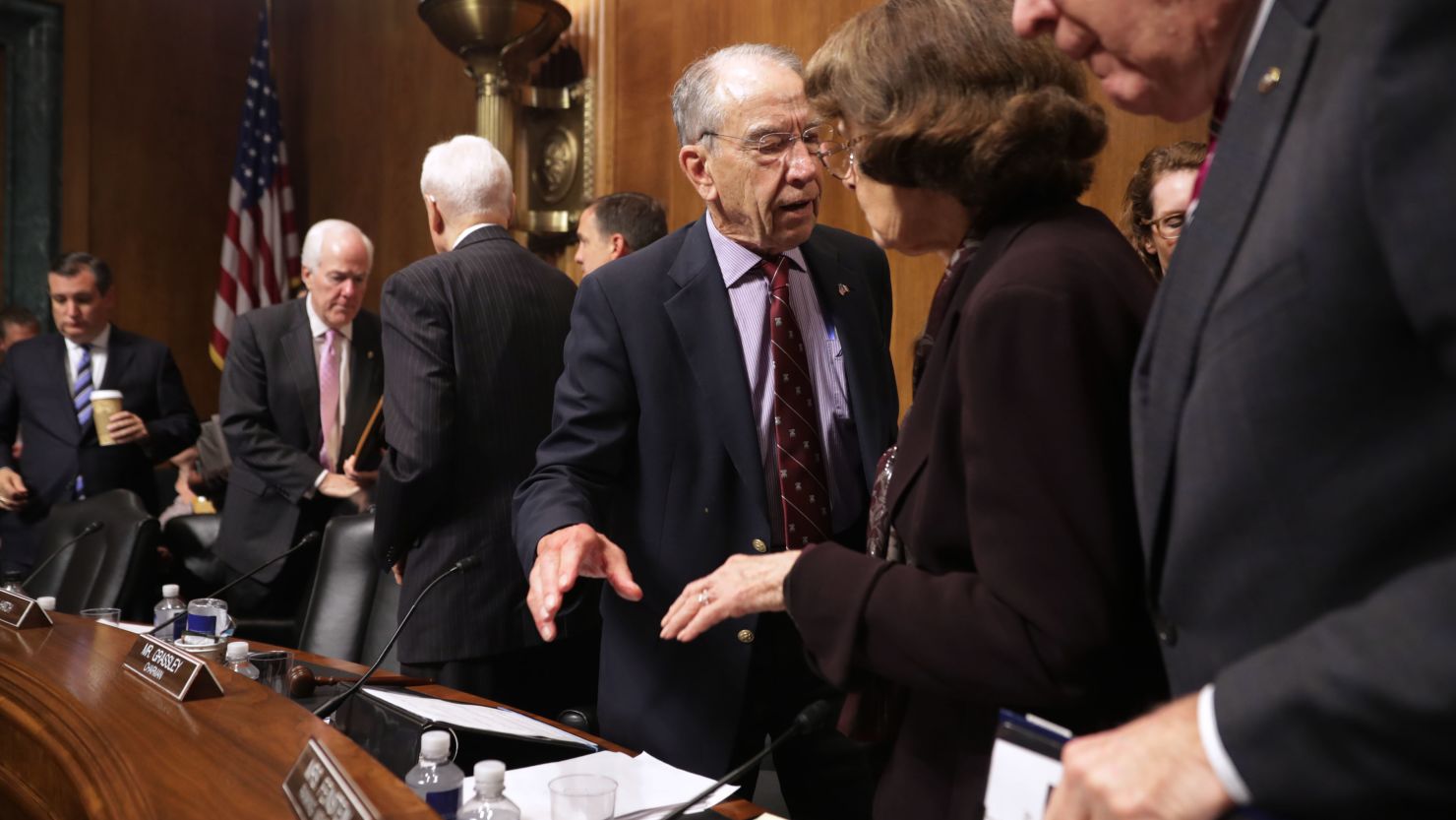 Senate Judiciary Committee Chairman Charles Grassley (R-IA) (C) talks with ranking member Sen. Dianne Feinstein after the committee voted out Supreme Court nominee Judge Brett Kavanaugh at the conclusion of a mark-up hearing in the Dirksen Senate Office Building on Capitol Hill September 28, 2018 in Washington. 