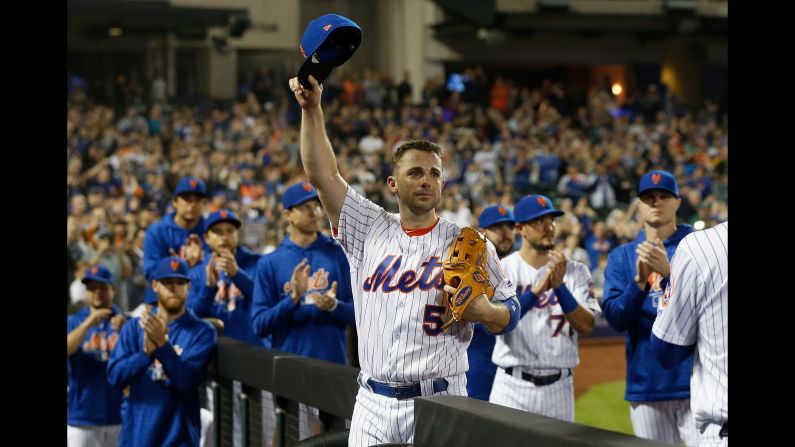 New York Mets third baseman David Wright acknowledges the crowd as he comes out of the final baseball game of his career during the fifth inning on Saturday, September 29, in New York. The 35-year-old received a standing ovation from his fans.