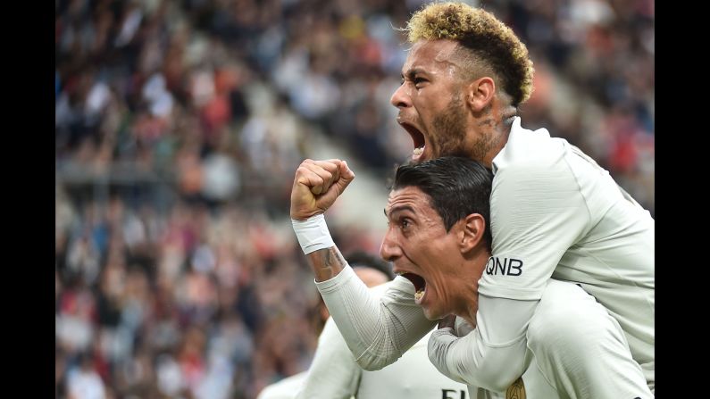 Neymar and Angel Di Maria of Paris Saint-Germain celebrate after scoring the equalizer during the French L1 soccer match against Rennes on Sunday, September 23.