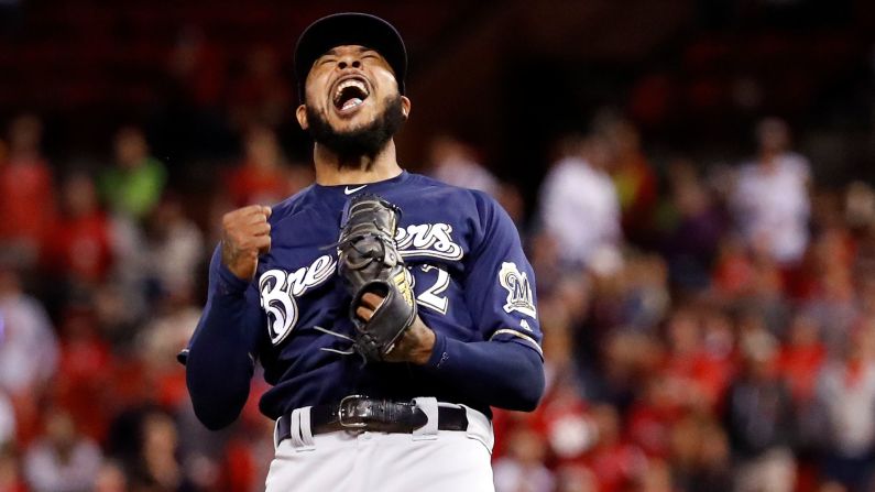 Milwaukee Brewers relief pitcher Jeremy Jeffress celebrates after striking out the St. Louis Cardinals' Tyler O'Neill for the final out of the baseball game on Wednesday, September 26, in St. Louis. The Brewers won 2-1 to clinch a postseason spot. 