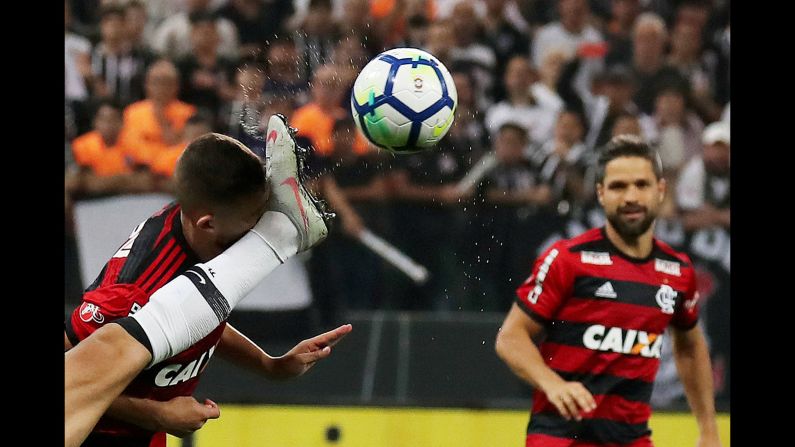 Corinthians' Douglas Augusto gets a leg in the face as he goes for the ball in the Copa Do Brasil soccer semifinals on Wednesday, September 26. The Corinthians defeated Flamengo 2-1.