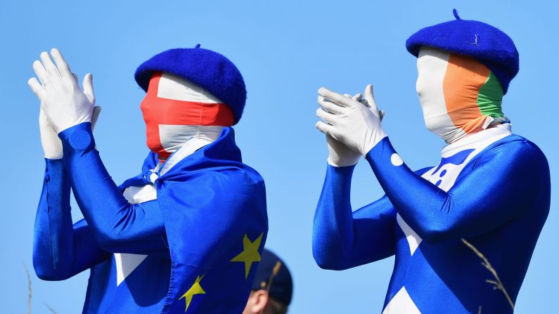 European fans applaud on Saturday, September 29, during the foursome golf matches of the Ryder Cup in Paris.