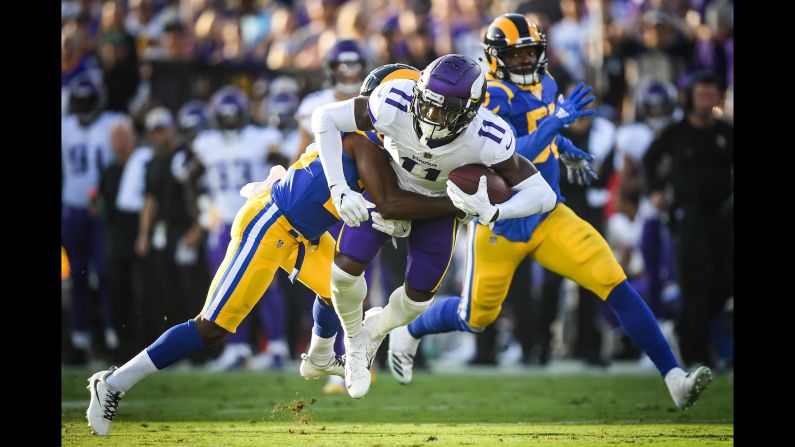 Laquon Treadwell of the Minnesota Vikings is tackled by Lamarcus Joyner of the Los Angeles Rams after his catch in the first quarter of football on Thursday, September 27, in Los Angeles.
