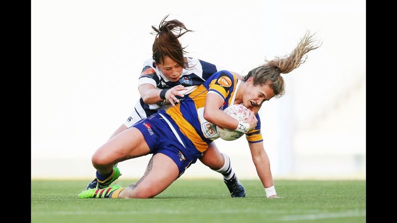 Hana Tapiata of Bay of Plenty is tackled by Misaki Suzuki of Auckland during a Farah Palmer Cup rugby match on Friday, September 28, in Auckland, New Zealand.