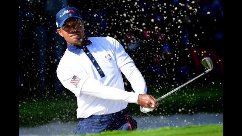 Golfer Tiger Woods of the United States plays out of a bunker during the Ryder Cup foursomes matches on Saturday, September 29, in Paris.