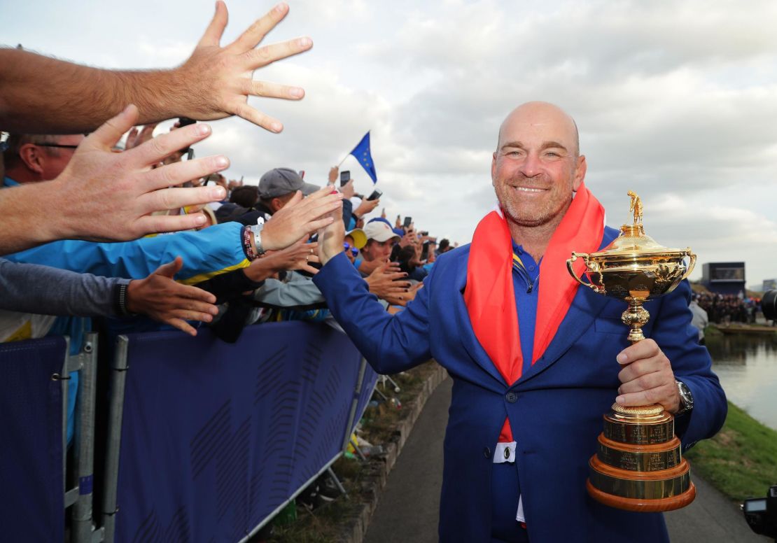 Bjorn holds The Ryder Cup as Europe celebrates victory 