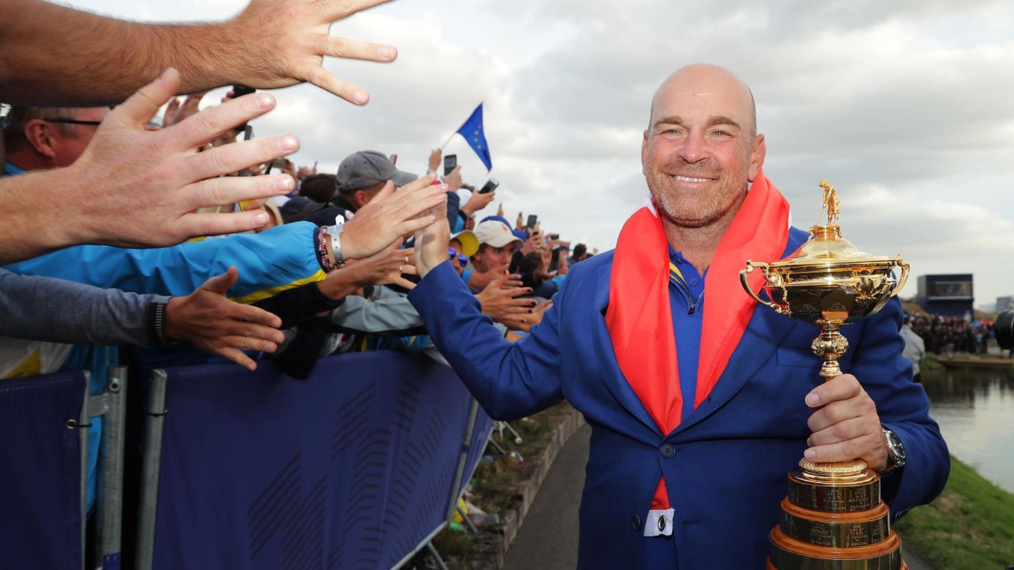 Captain Thomas Bjorn holds the Ryder Cup as the European team celebrates at Le Golf National in Paris in September. 