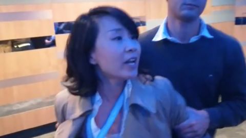 A Chinese journalist was captured on video yelling at a side session of the annual conference of the UK's Conservative Party.