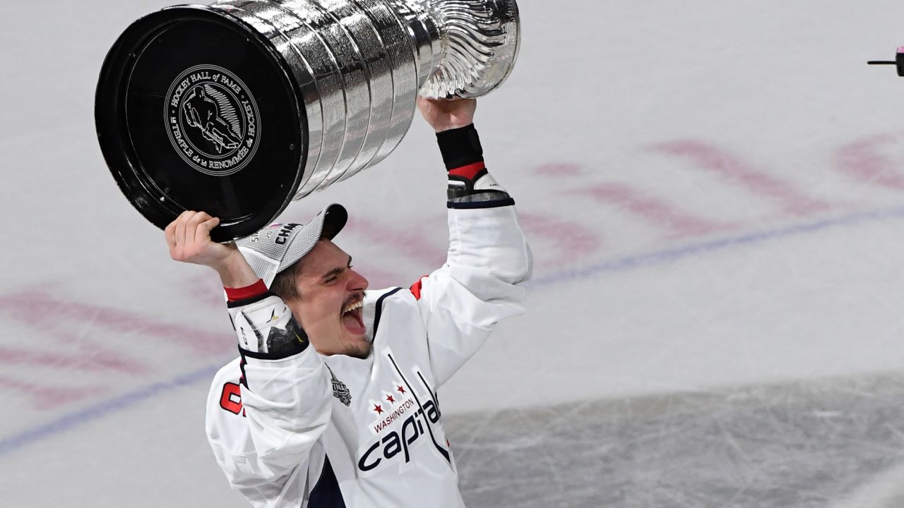 Dmitry Orlov hoists the Stanley Cup after the team's 4-3 win over the Vegas Golden Knights in Game Five of the 2018 NHL Stanley Cup Final.