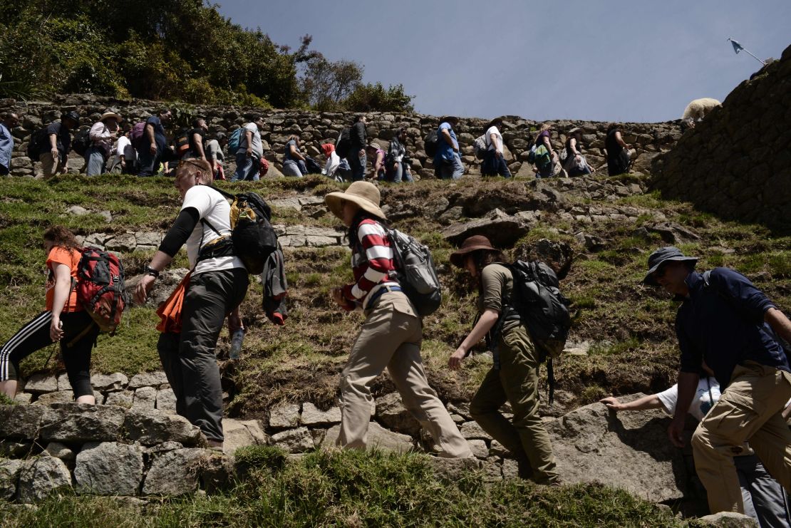 Travelers line up to visit Machu Picchu.