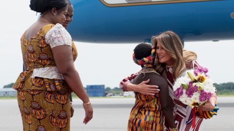 Melania Trump receives flowers during an arrival ceremony after landing at Kotoka International Airport in Accra, Ghana, on Tuesday.