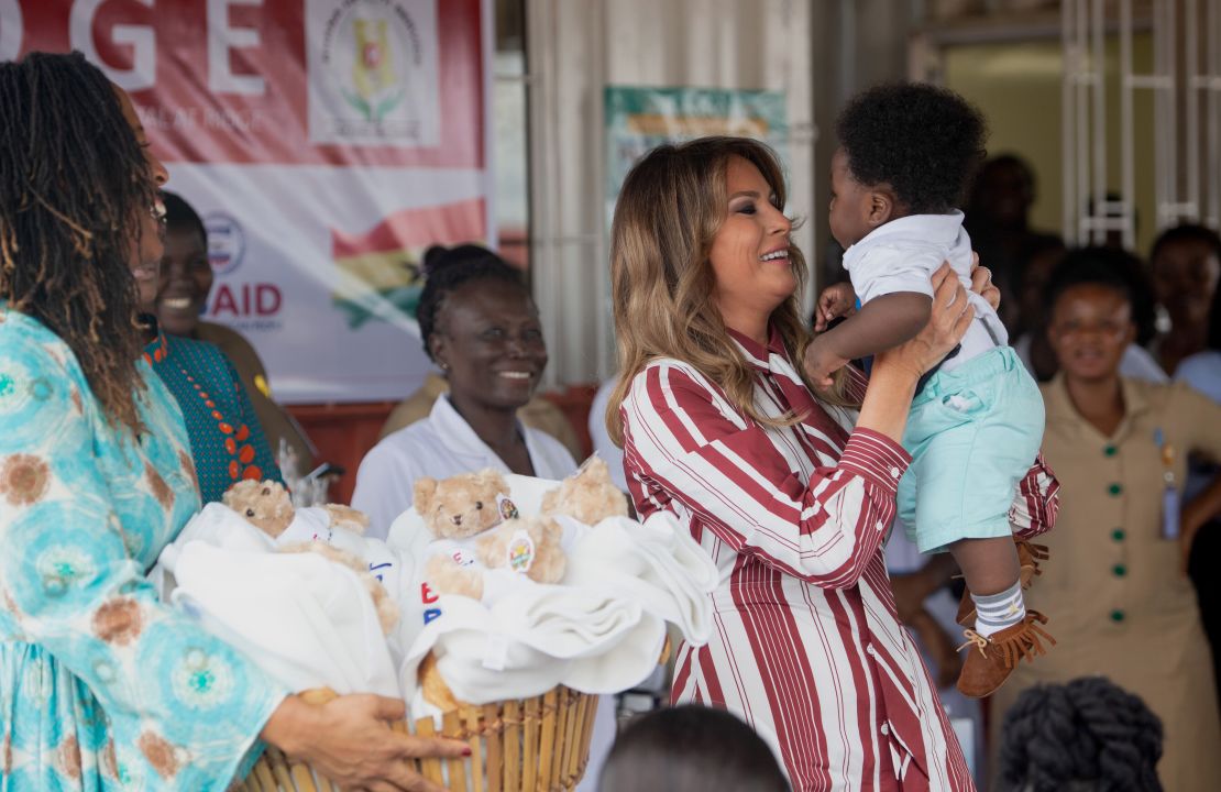 US First Lady Melania Trump holds a baby during a visit to the Greater Accra Regional Hospital in Accra, on October 2, 2018, as she begins her week long trip to Africa to promote her 'Be Best' campaign. (Photo by SAUL LOEB / AFP)        (Photo credit should read SAUL LOEB/AFP/Getty Images)