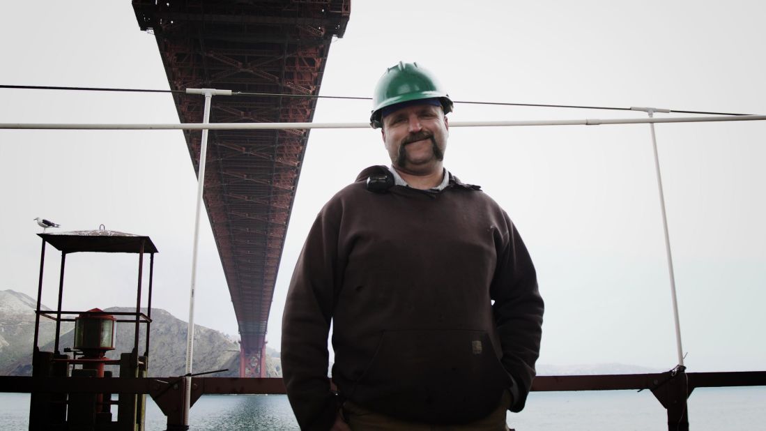 <strong>Operating the bridge.</strong> Aaron Kozlowski, the bridge's chief operating engineer, oversees a team whose work includes maintaining a lot of the equipment that makes the bridge run, including the lines that feed air pressure into the fog horns and the equipment for blasting operations, while also operating all the cranes for lifting and hoisting operations.