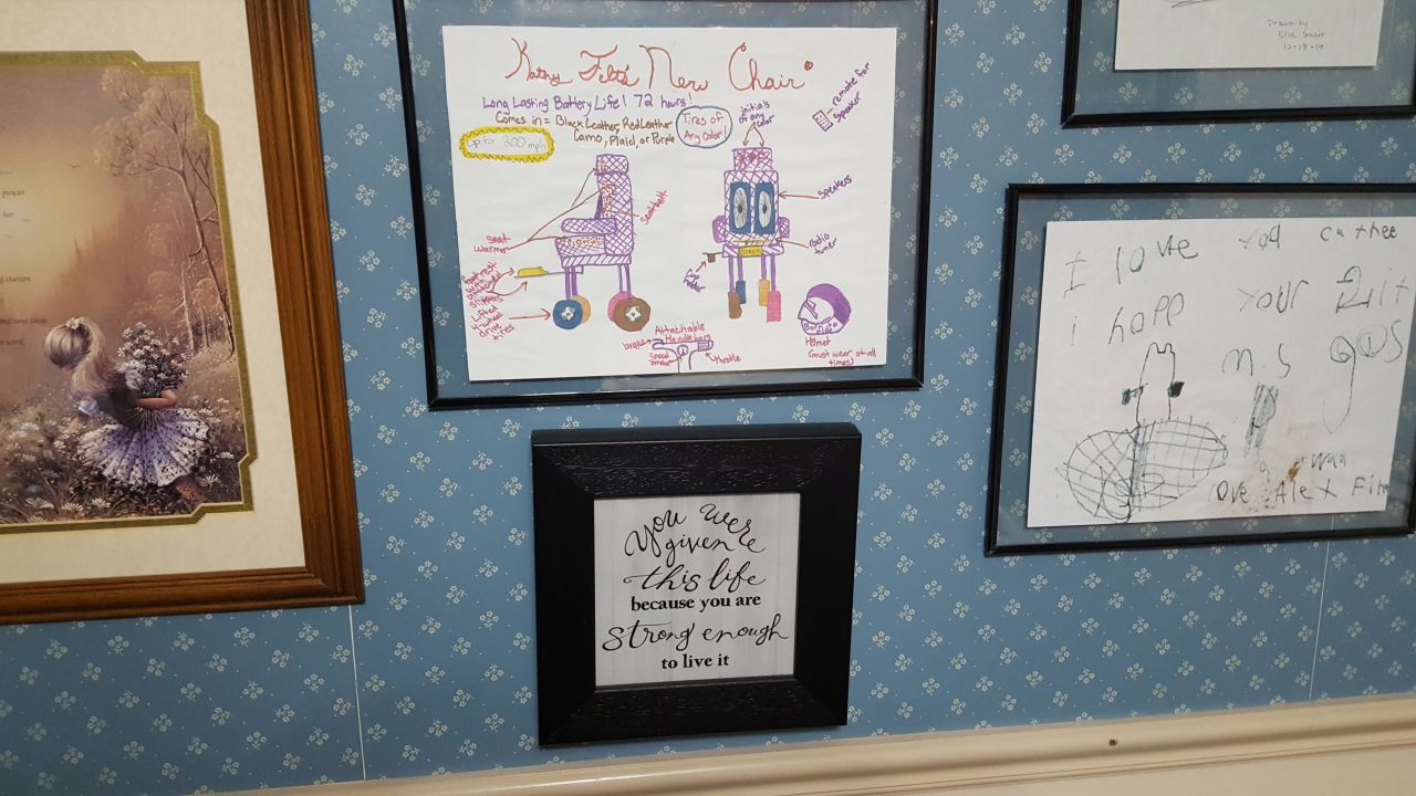 Kathy Felt's wall is covered with drawings and notes from volunteers' children.