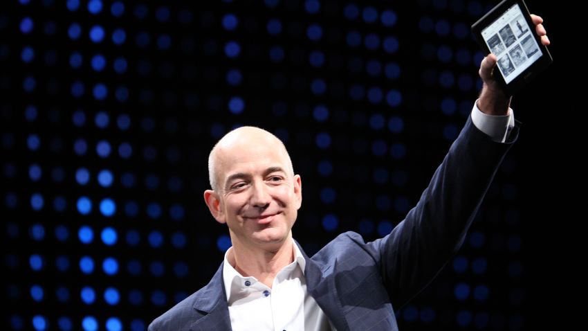 SANTA MONICA, CA - SEPTEMBER 6: Amazon CEO Jeff Bezos holds a new front-lit Kindle Paperwhite 3G reading device during a press conference on September 6, 2012 in Santa Monica, California. Amazon unveilved the Kindle Paperwhite and the Kindle Fire HD in 7 and 8.9-inch sizes. (Photo by David McNew/Getty Images)