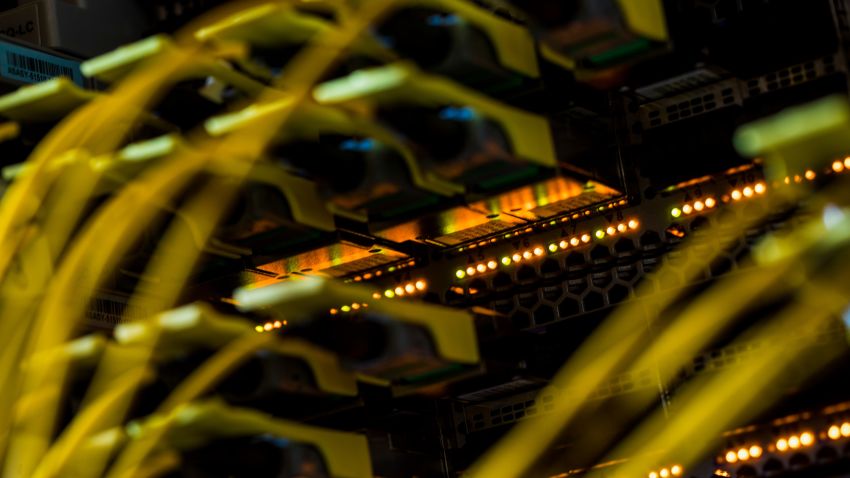 Fiber optic cables feed into a switch inside a communications room at an office in London, U.K., on Monday, May 21, 2018. The Department of Culture, Media and Sport will work with the Home Office to publish a white paper later this year setting out legislation, according to a statement, which will also seek to force tech giants to reveal how they target abusive and illegal online material posted by users. Photographer: Jason Alden/Bloomberg via Getty Images