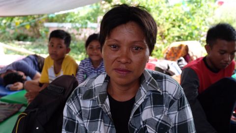 Indonesian public servant Muryatim Galanu considers her loses after being forced to flee her village, Petobo, following Friday's earthquake.