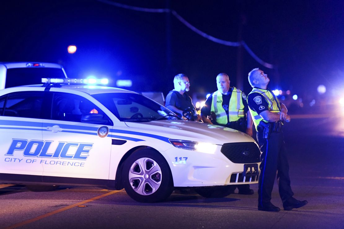 Authorities direct traffic Wednesday near the shooting scene in Florence, South Carolina.