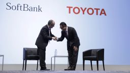 Masayoshi Son, chairman and chief executive officer of SoftBank Group Corp., left, shakes hands with Akio Toyoda, president of Toyota Motor Corp., during a news conference in Tokyo, Japan, on Thursday, Oct. 4, 2018. Japan's SoftBank and Toyota are teaming up on ride-hailing and self-driving cars as they accelerate their push into a market dominated by U.S. technology and car companies. Photographer: Kiyoshi Ota/Bloomberg via Getty Images
