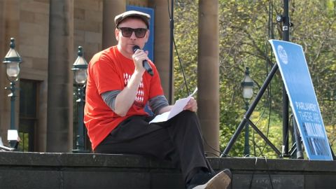 Murdoch addresses a crowd in Edinburgh, Scotland, at a #MillionsMissing rally.