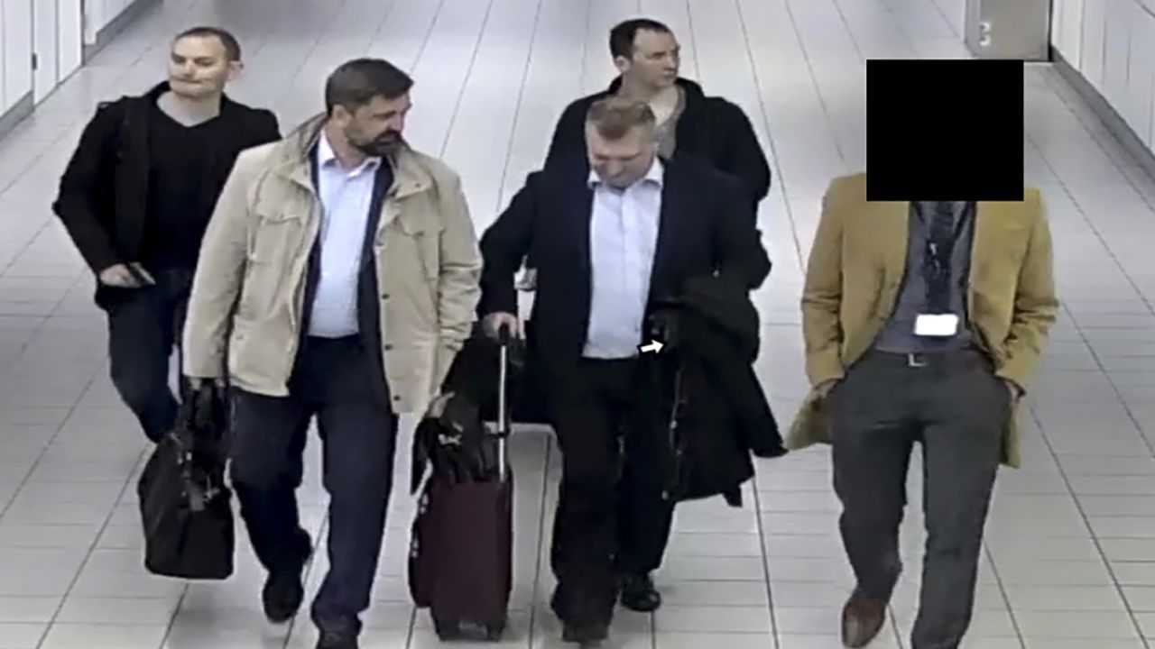 In this image released and manipulated at source by the Dutch Defense Ministry, Thursday Oct. 4, 2018, four Russian officers of the Main Directorate of the General Staff of the Armed Forces of the Russian Federation, GRU, are escorted to their flight after being expelled from the Netherlands on April 13, 2018, for allegedly trying to hack into the U.N. chemical watchdog OPCW's network. The Dutch defense minister on Thursday Oct. 4, 2018, accused Russia's military intelligence unit of attempted cybercrimes targeting the U.N. chemical weapons watchdog and the investigation into the 2014 Malaysian Airlines crash over Ukraine.(Dutch Defense Ministry via AP)