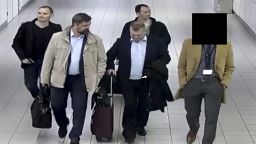 In this image released and manipulated at source by the Dutch Defense Ministry, Thursday Oct. 4, 2018, four Russian officers of the Main Directorate of the General Staff of the Armed Forces of the Russian Federation, GRU, are escorted to their flight after being expelled from the Netherlands on April 13, 2018, for allegedly trying to hack into the U.N. chemical watchdog OPCW's network. The Dutch defense minister on Thursday Oct. 4, 2018, accused Russia's military intelligence unit of attempted cybercrimes targeting the U.N. chemical weapons watchdog and the investigation into the 2014 Malaysian Airlines crash over Ukraine.(Dutch Defense Ministry via AP)