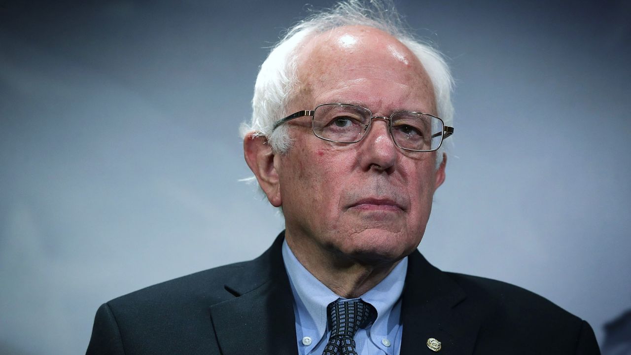 US Sen. Bernie Sanders (I-VT) listens during a news conference about private prisons September 17, 2015 on Capitol Hill in Washington, DC. Sanders was joined by Rep. Keith Ellison (D-MN) to announce that they will introduce bills to ban private prisons.
