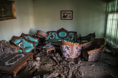 Furniture sits partially submerged in mud in a Palu house on October 4.