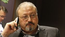 FILE - In this Jan. 29, 2011, file photo, Saudi Arabian journalist Jamal Khashoggi speaks on his cellphone at the World Economic Forum in Davos, Switzerland. The Washington Post said Wednesday, Oct. 3, 2018, it was concerned for the safety of Khashoggi, a columnist for the newspaper, after he apparently went missing after going to the Saudi Consulate in Istanbul. (AP Photo/Virginia Mayo, File)