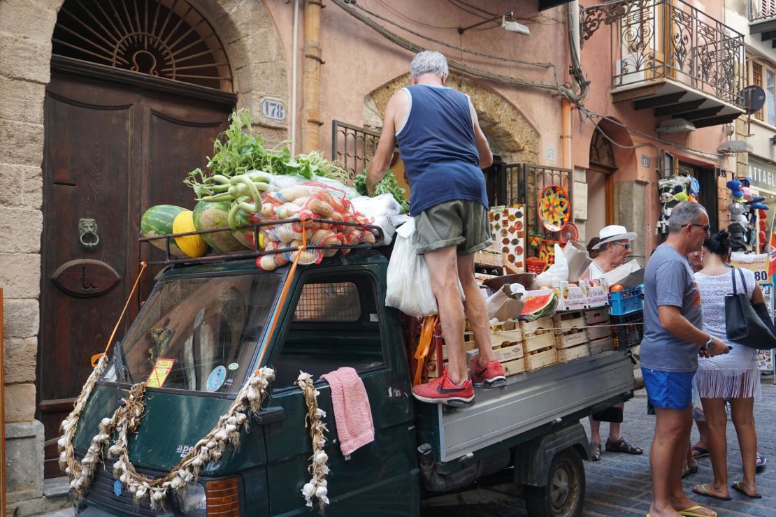Sometimes the market comes to you. Fresh fruit and vegetables sold off a cart in Cefalu Sicily.