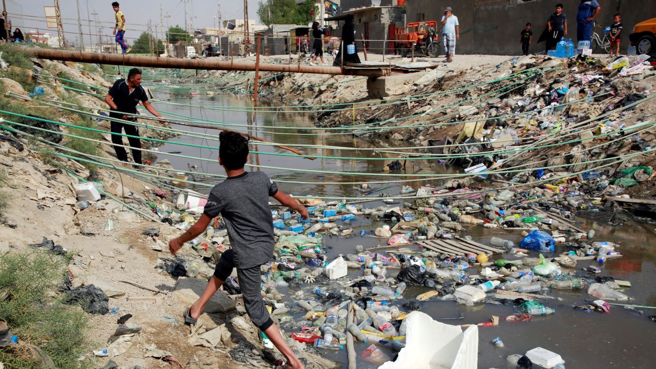 Al-Ashar River, filled with sewage and trash, runs through the old city of Basra  in September.