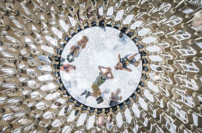 Turkish photographer Omer Kanipak photographed children peering through Wolfgang Buttress' installation, The Hive, at the Royal Botanic Gardens in Kew, UK. 