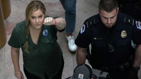 Amy Schumer is led away after she was arrested during a protest against Judge Brett Kavanaugh.