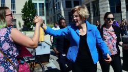 US Senator Elizabeth Warren (C) greets demonstrators protesting US Supreme Court nominee Brett Kavanaugh on October 4, 2018, in Washington, DC. - A new FBI investigation into Kavanaugh found nothing to corroborate sexual assault allegations against US President Donald Trump's nominee for the Supreme Court, US Senator Chuck Grassley of Iowa said Thursday. (Photo by Jim WATSON / AFP)        (Photo credit should read JIM WATSON/AFP/Getty Images)