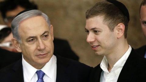 A file photo from March 2015 of Israeli Prime Minister Benjamin Netanyahu (L) and his son Yair. 