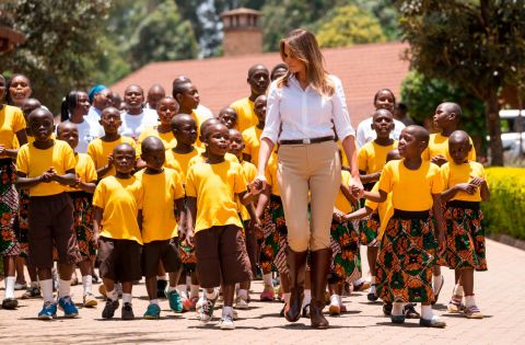 First lady Melania Trump walks with children from the Nest Orphanage during her visit to Nairobi.