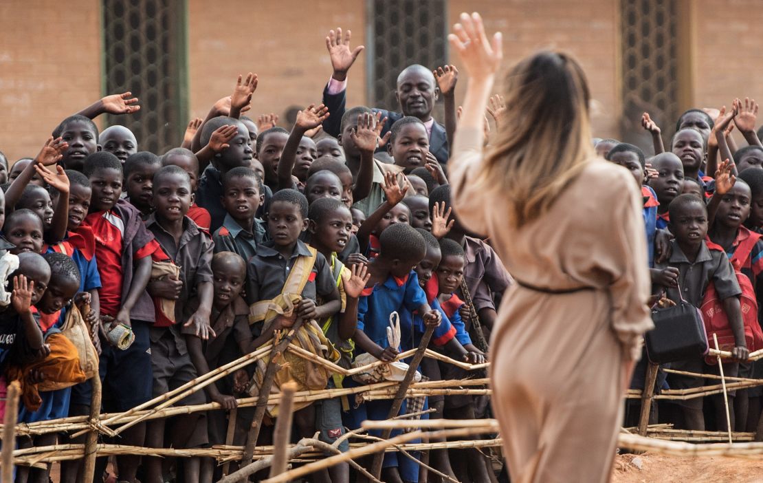 First lady Melania Trump waves to children at the Chipala Primary School in Lilongwe on October 4, 2018 during a 1-day visit in Malawi, part of her week long trip to Africa to promote her 'Be Best' campaign. (Photo by SAUL LOEB / AFP / Getty Images)