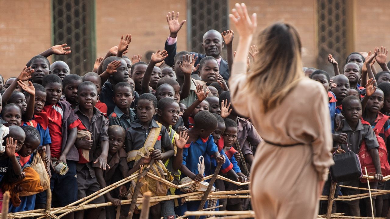 First lady Melania Trump waves to children at the Chipala Primary School in Lilongwe on October 4, 2018 during a 1-day visit in Malawi, part of her week long trip to Africa to promote her 'Be Best' campaign. (Photo by SAUL LOEB / AFP / Getty Images)