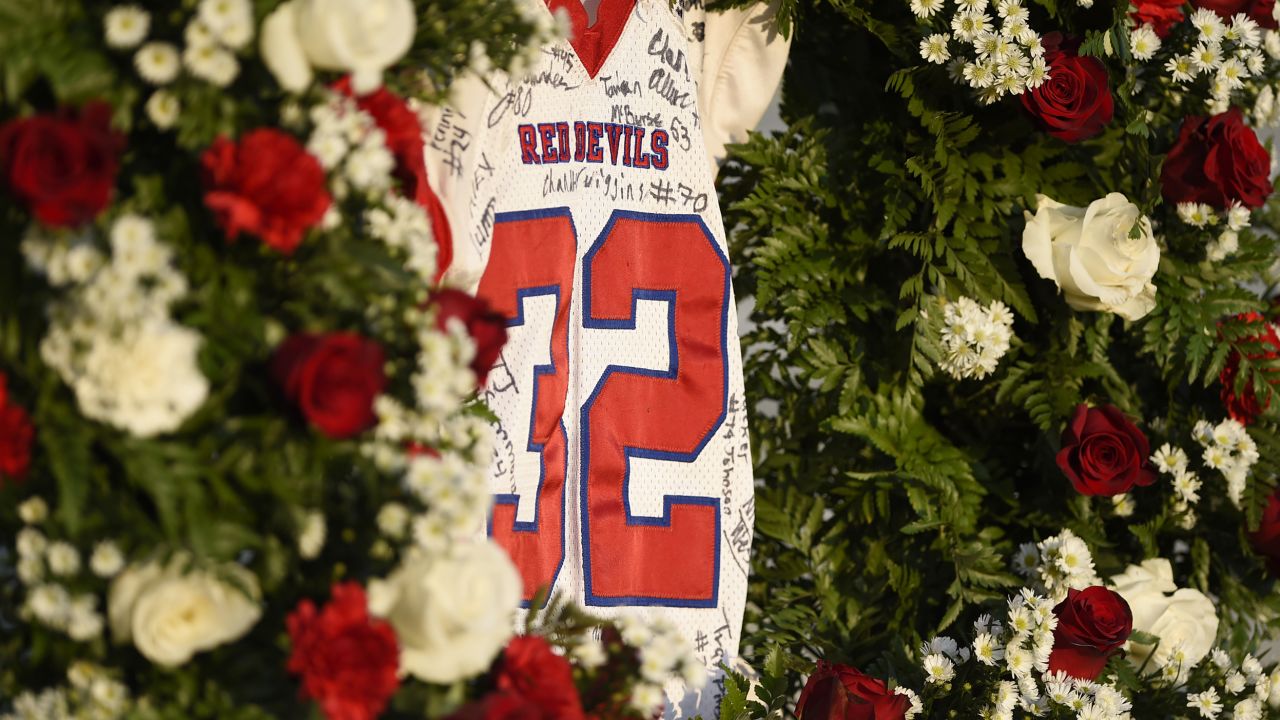 Dylan Thomas' jersey hangs in a wreath of roses before the Pike County High School game against Rutland High School. 